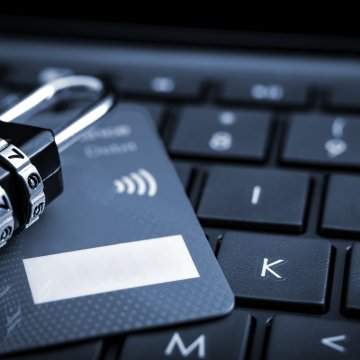 identity theft protection service lifelock identity guard lock on credit card on black computer keyboard